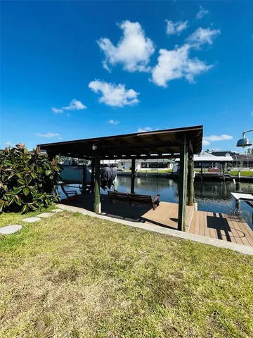 a view of a swimming pool with an outdoor space and seating area