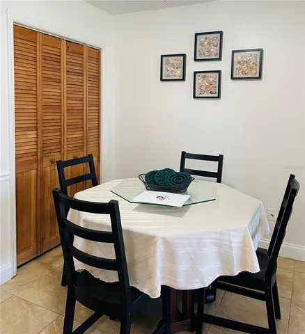 a dining room with a table and chairs