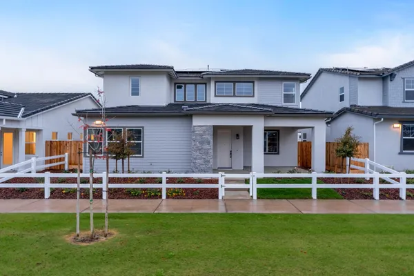 front view of a house with a yard