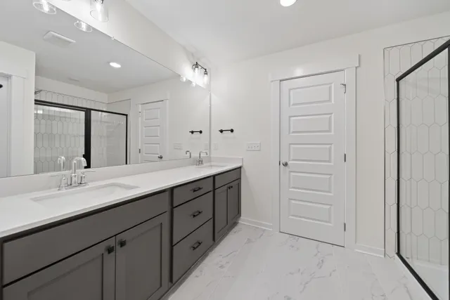 a bathroom with a double vanity sink mirror and double