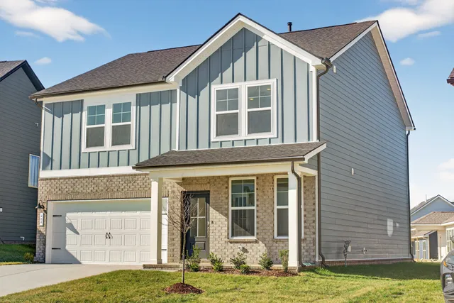 a view of a house with swimming pool and front door