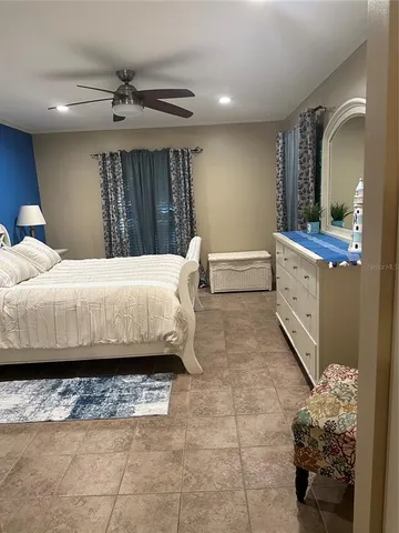 a bedroom with a bed and a dresser