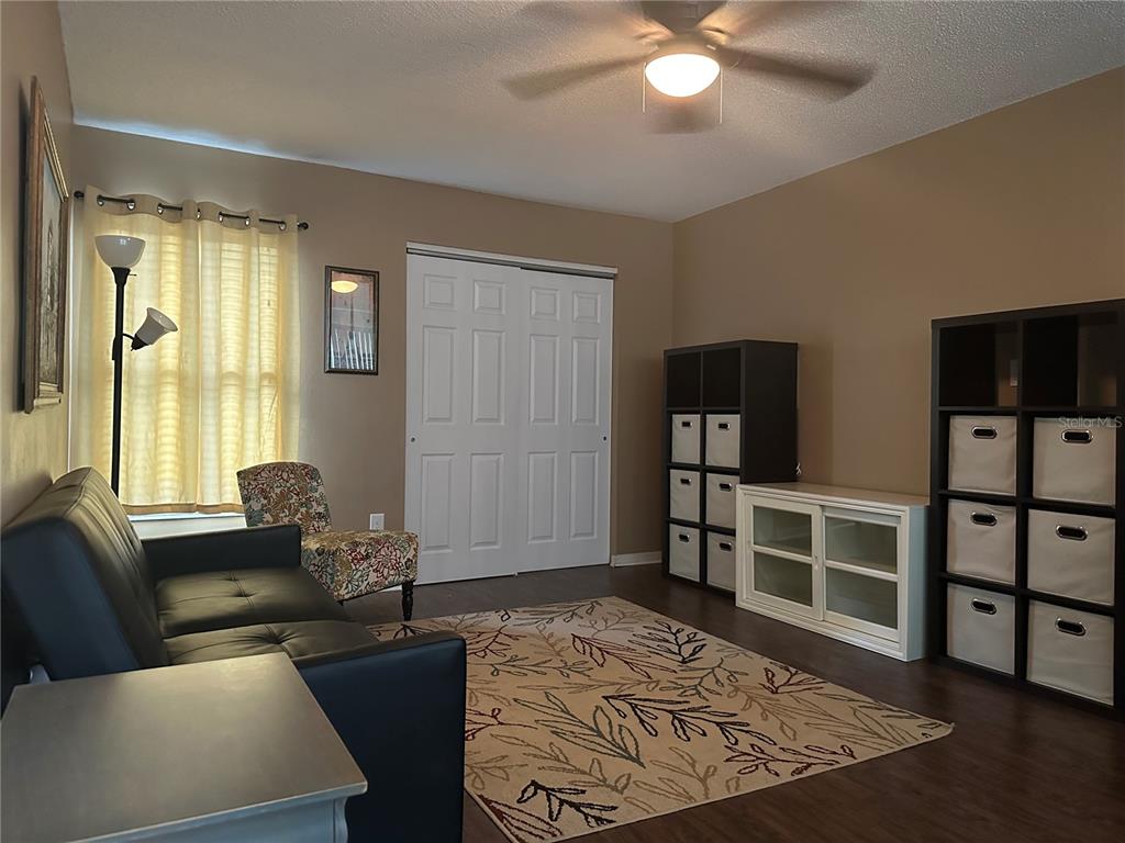 600 Cranes Way, Unit 204 Altamonte Springs, FL 32701 - Photo 16 of 26 a living room with furniture and a flat screen tv