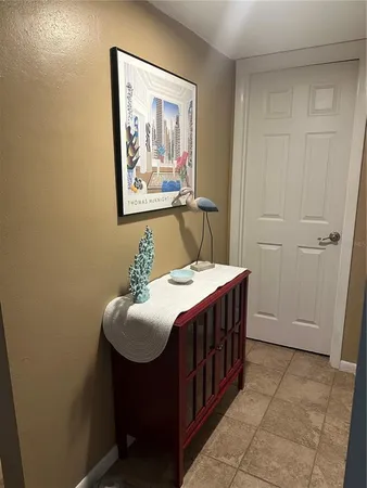 a room with a table chairs and a table