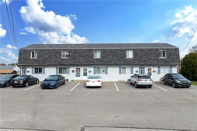 a view of a car parked in front of a building