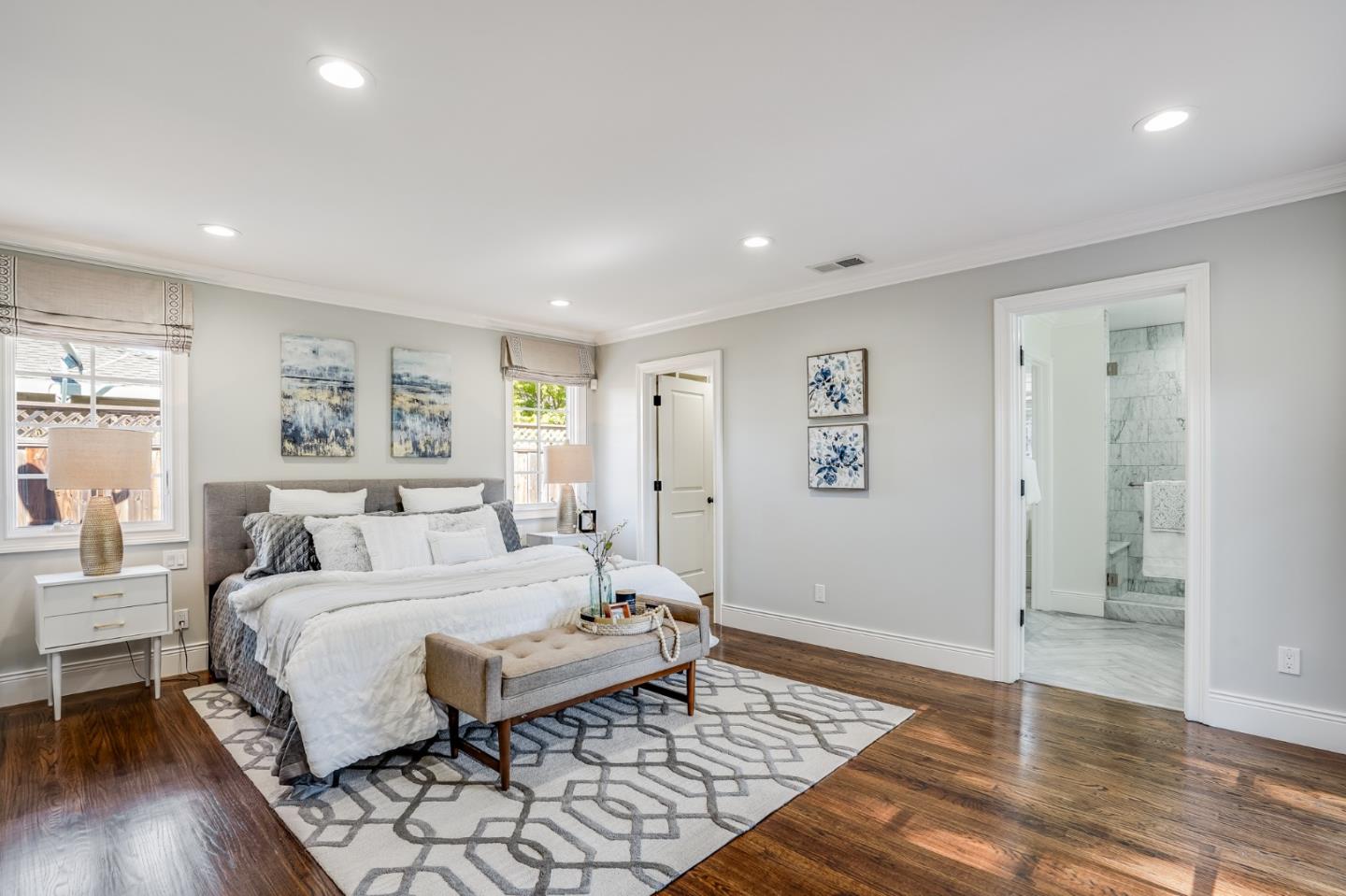 1481 Brookmill Road Los Altos, CA 94024 - Photo 24 of 55 a spacious bedroom with a bed and wooden floor