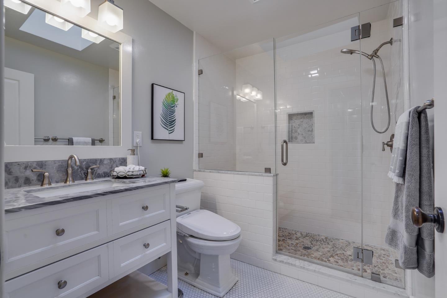 1481 Brookmill Road Los Altos, CA 94024 - Photo 36 of 55 a bathroom with a toilet a sink a mirror a shower and vanity
