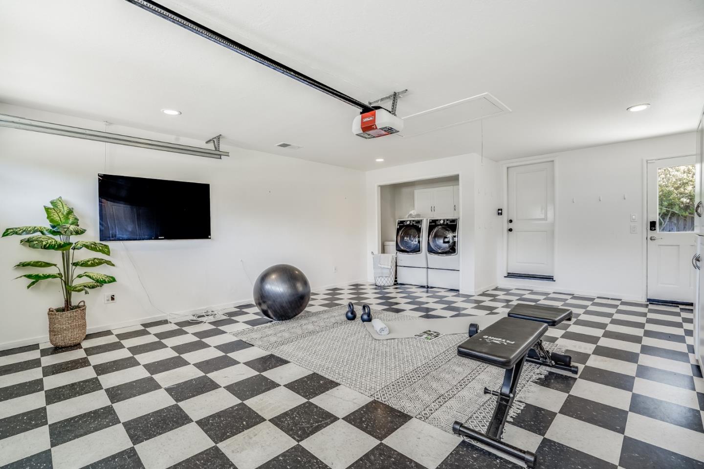 1481 Brookmill Road Los Altos, CA 94024 - Photo 39 of 55 a living room with a black white checkered floor