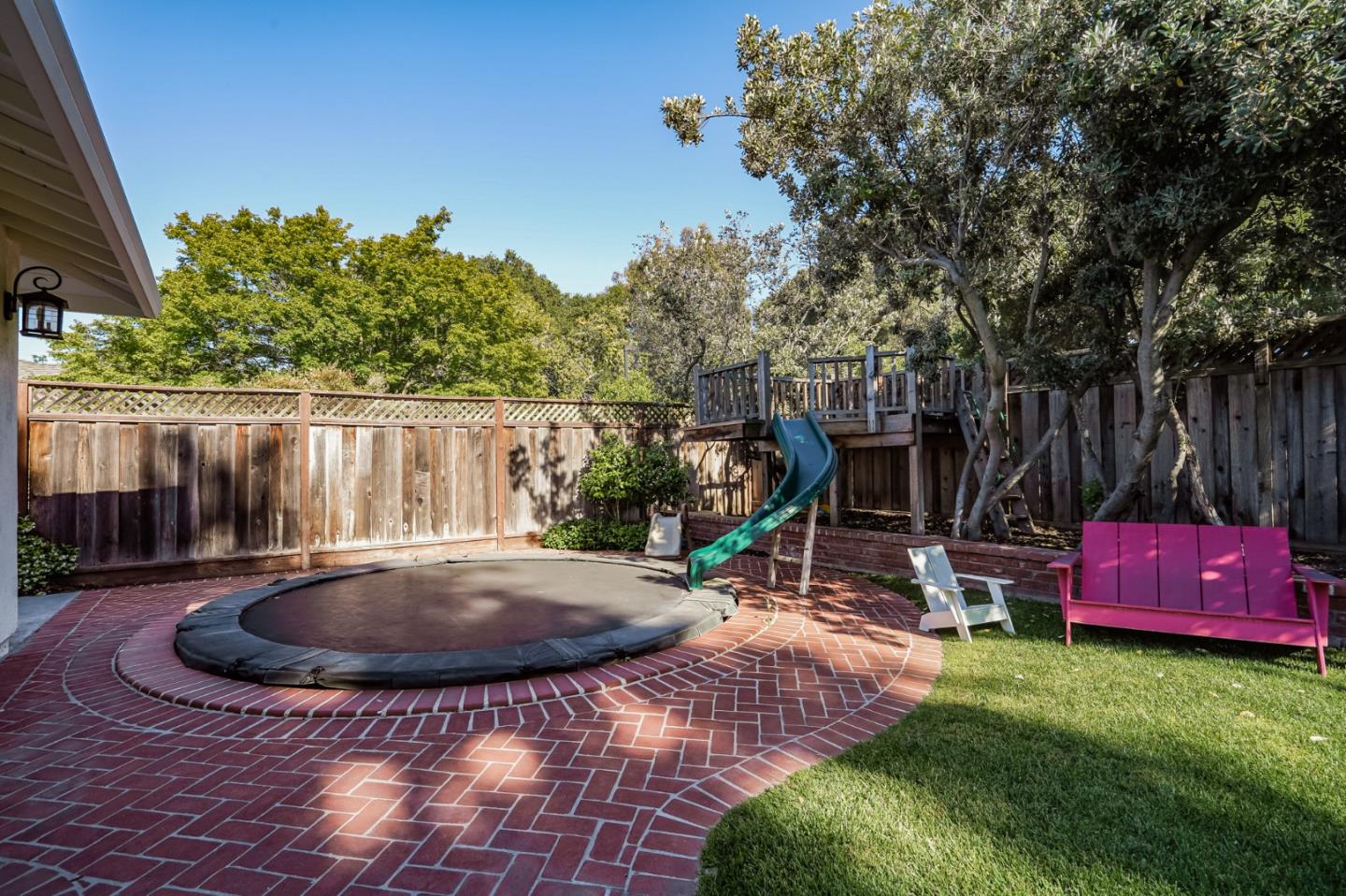 1481 Brookmill Road Los Altos, CA 94024 - Photo 43 of 55 a view of a backyard with table and chairs potted plants and large tree