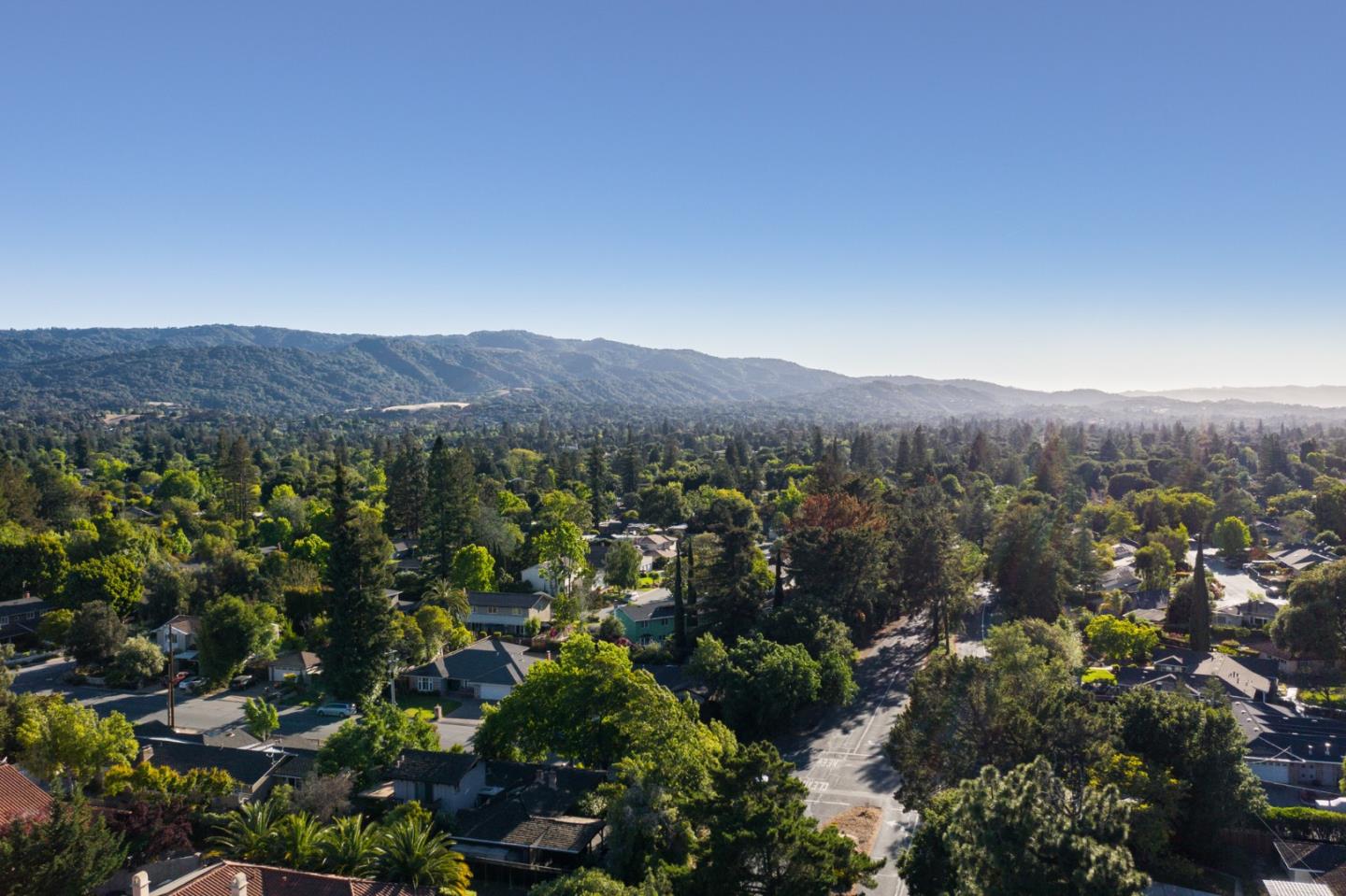 1481 Brookmill Road Los Altos, CA 94024 - Photo 55 of 55 a view of a lush green field with mountains in the background