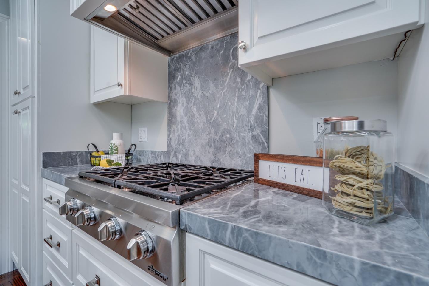 1481 Brookmill Road Los Altos, CA 94024 - Photo 10 of 55 a kitchen with stainless steel appliances granite countertop a stove and a sink