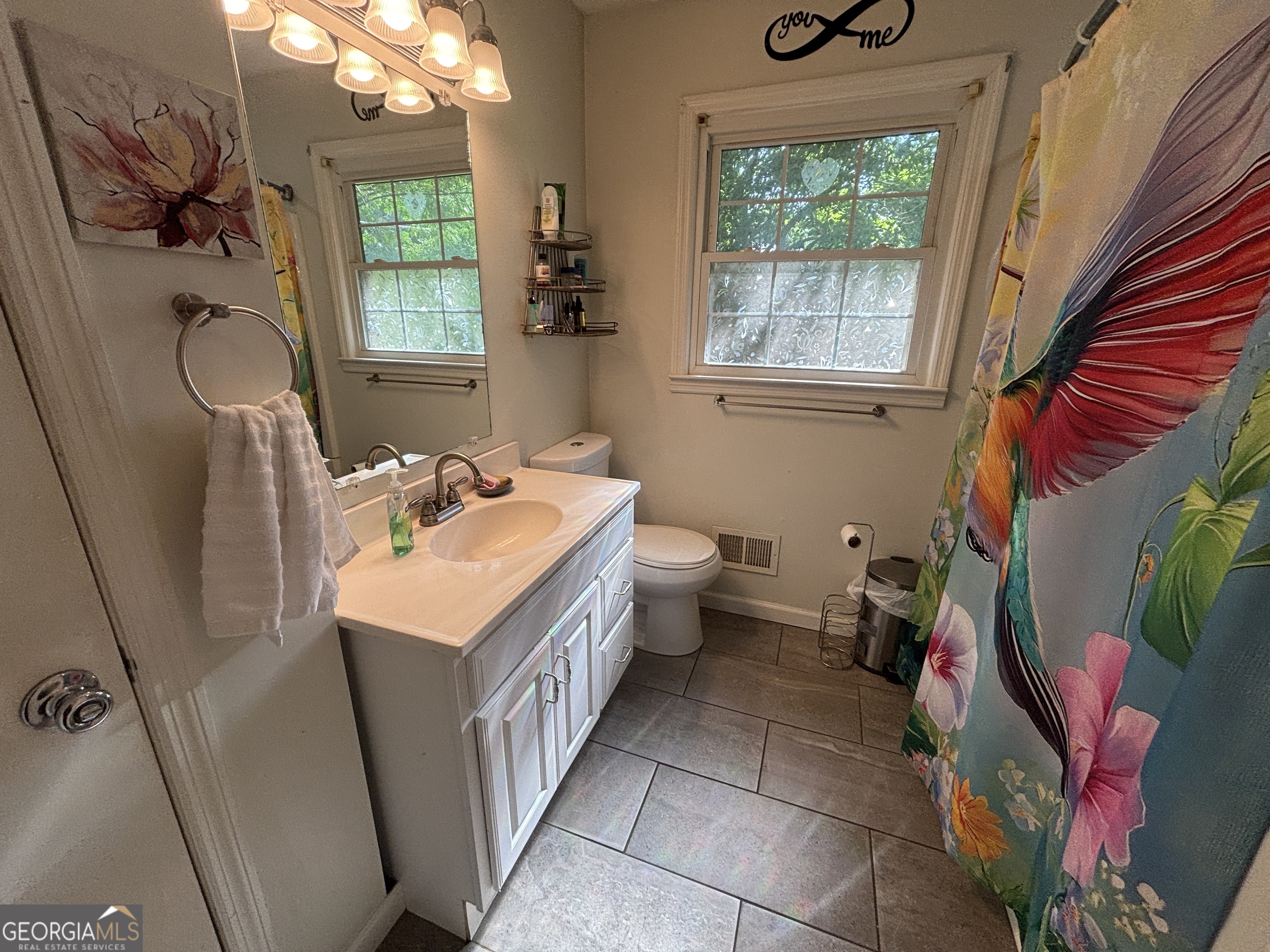 152 Crest Drive Cochran, GA 31014 - Photo 30 of 54 a bathroom with a sink a vanity and a mirror