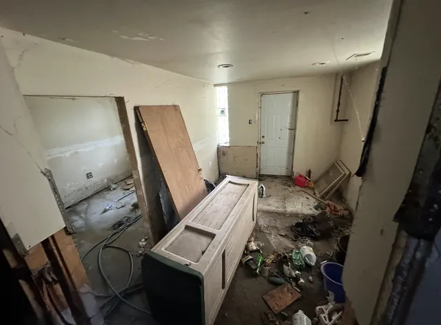 a room with furniture and a mirror