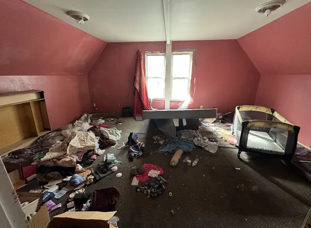a bathroom with a sink mirror and window
