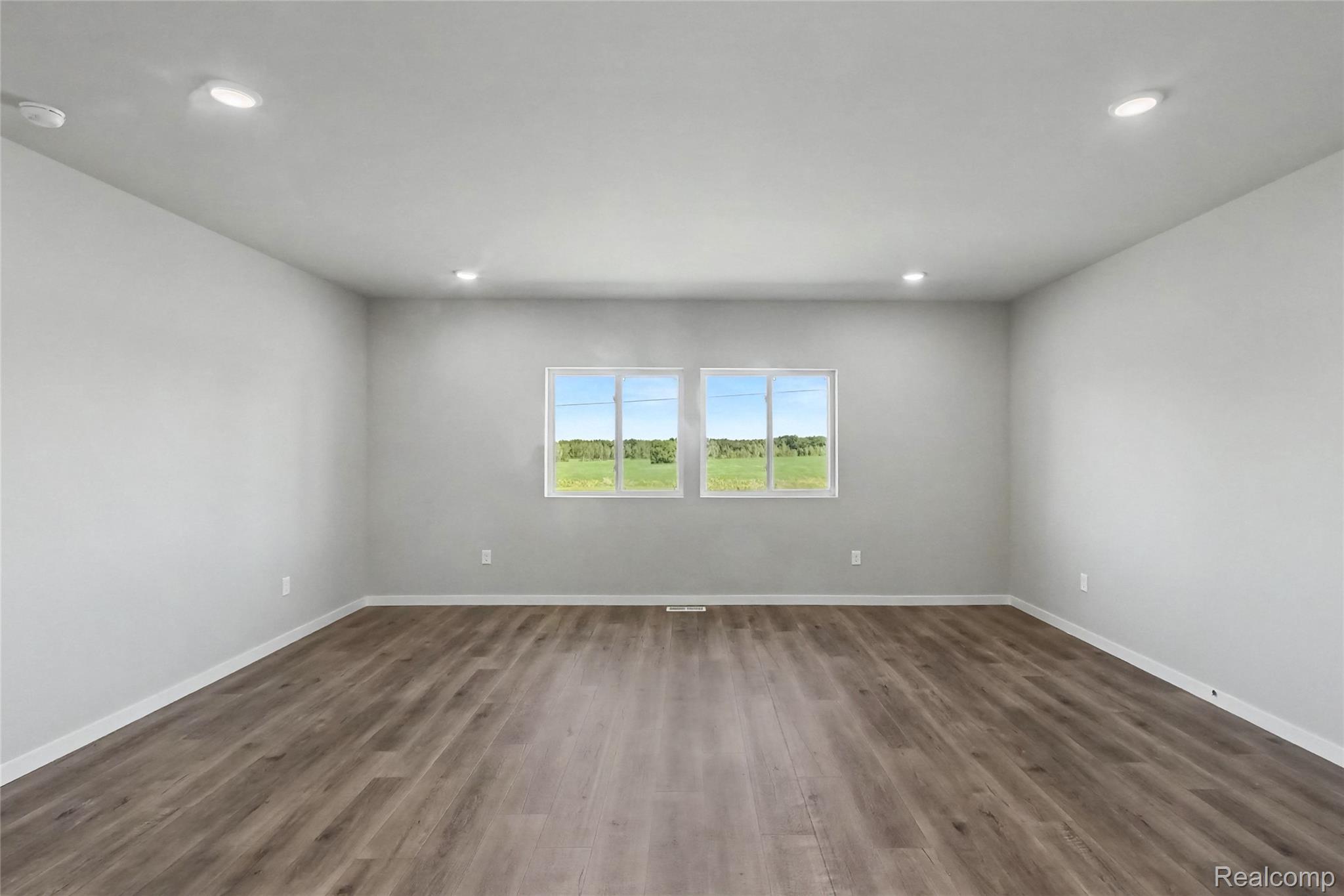5528 Lahring Road Linden, MI 48451 - Photo 36 of 39 The open concept floorplan allows cohesive flow between the kitchen and dining room to a spacious great room.