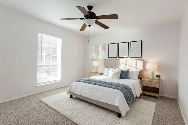 a bedroom with bed and window