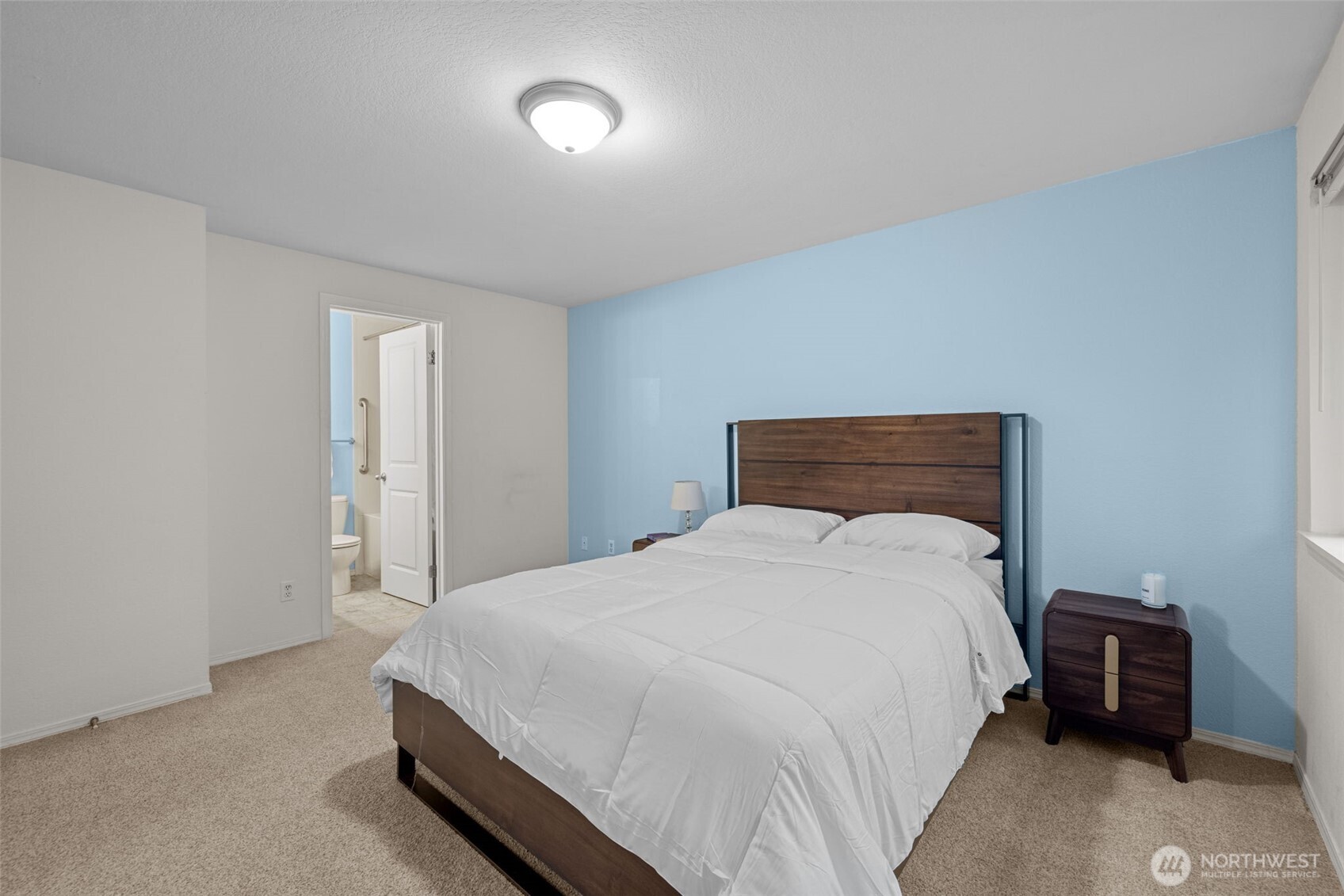 18429 20th Drive Southeast Bothell, WA 98012 - Photo 14 of 26 a bedroom with a bed and a chair