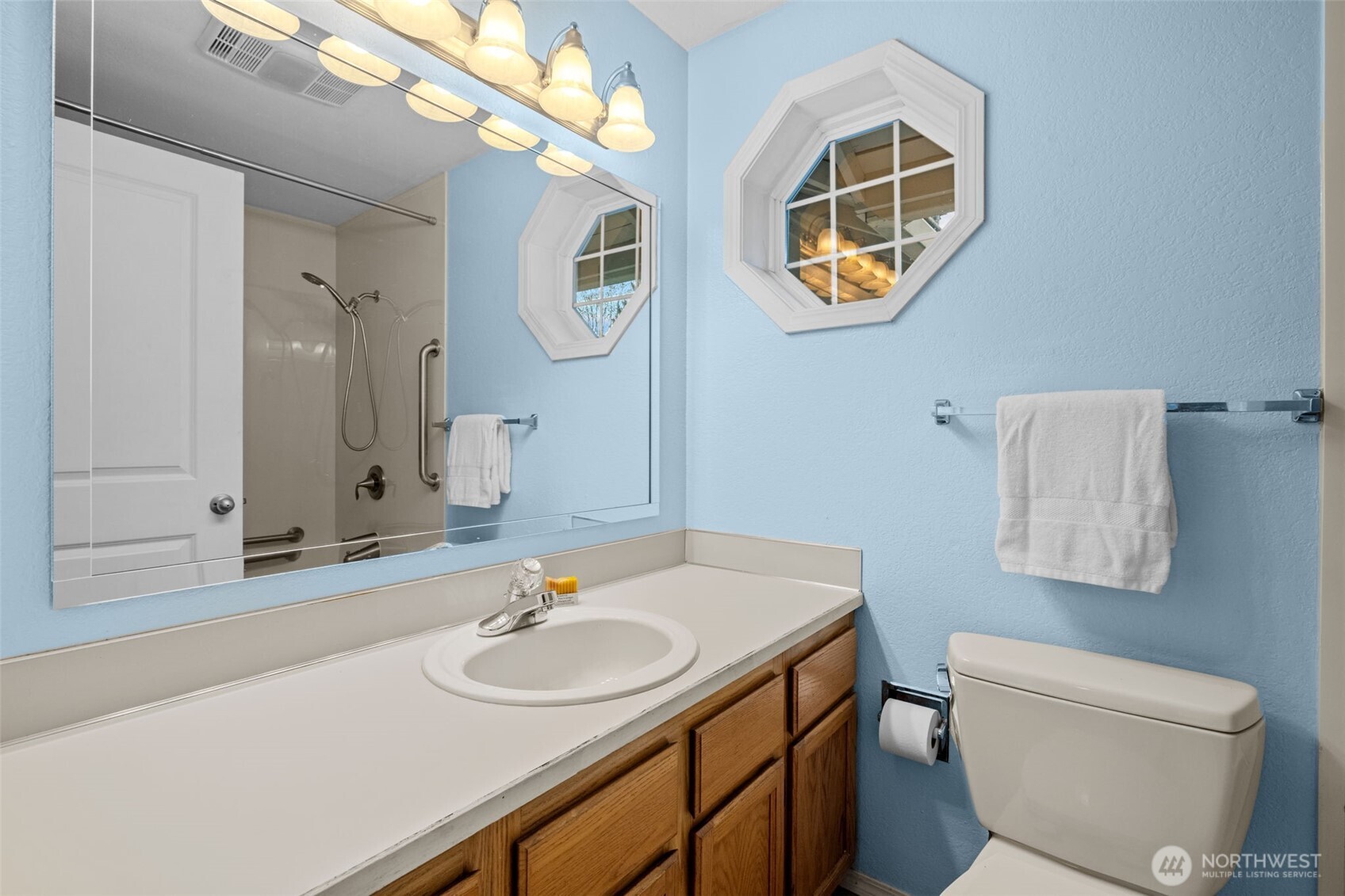 18429 20th Drive Southeast Bothell, WA 98012 - Photo 15 of 26 a bathroom with a sink and a mirror