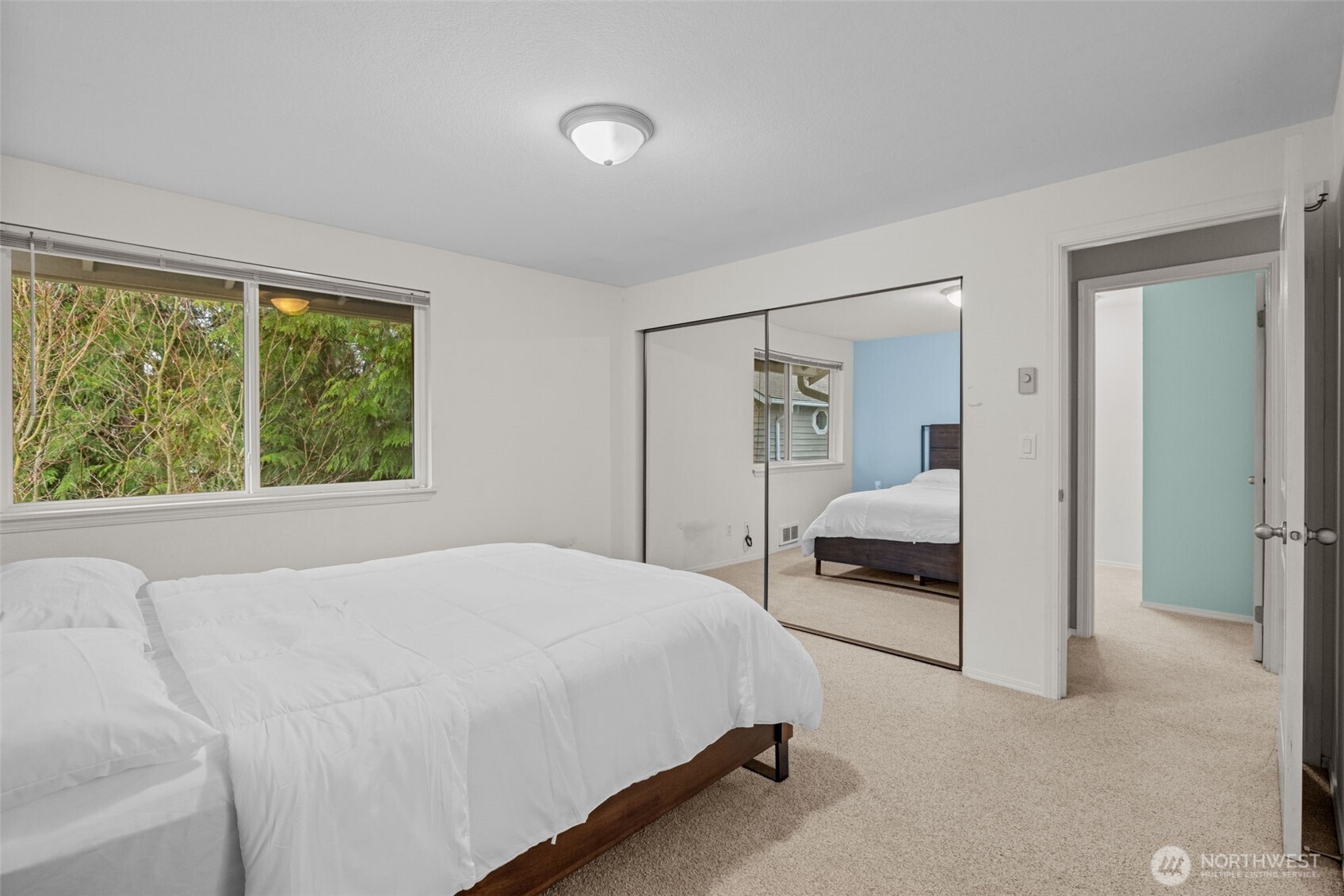 18429 20th Drive Southeast Bothell, WA 98012 - Photo 16 of 26 a bedroom with a bed and a large window