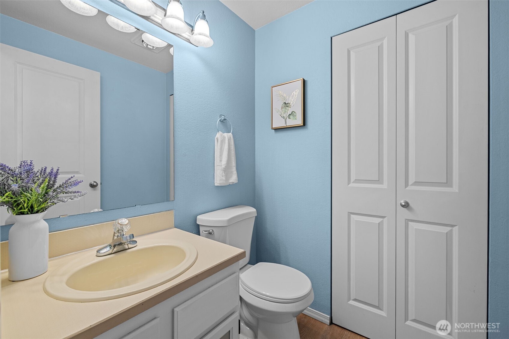 18429 20th Drive Southeast Bothell, WA 98012 - Photo 4 of 26 a bathroom with a sink vanity mirror and toilet