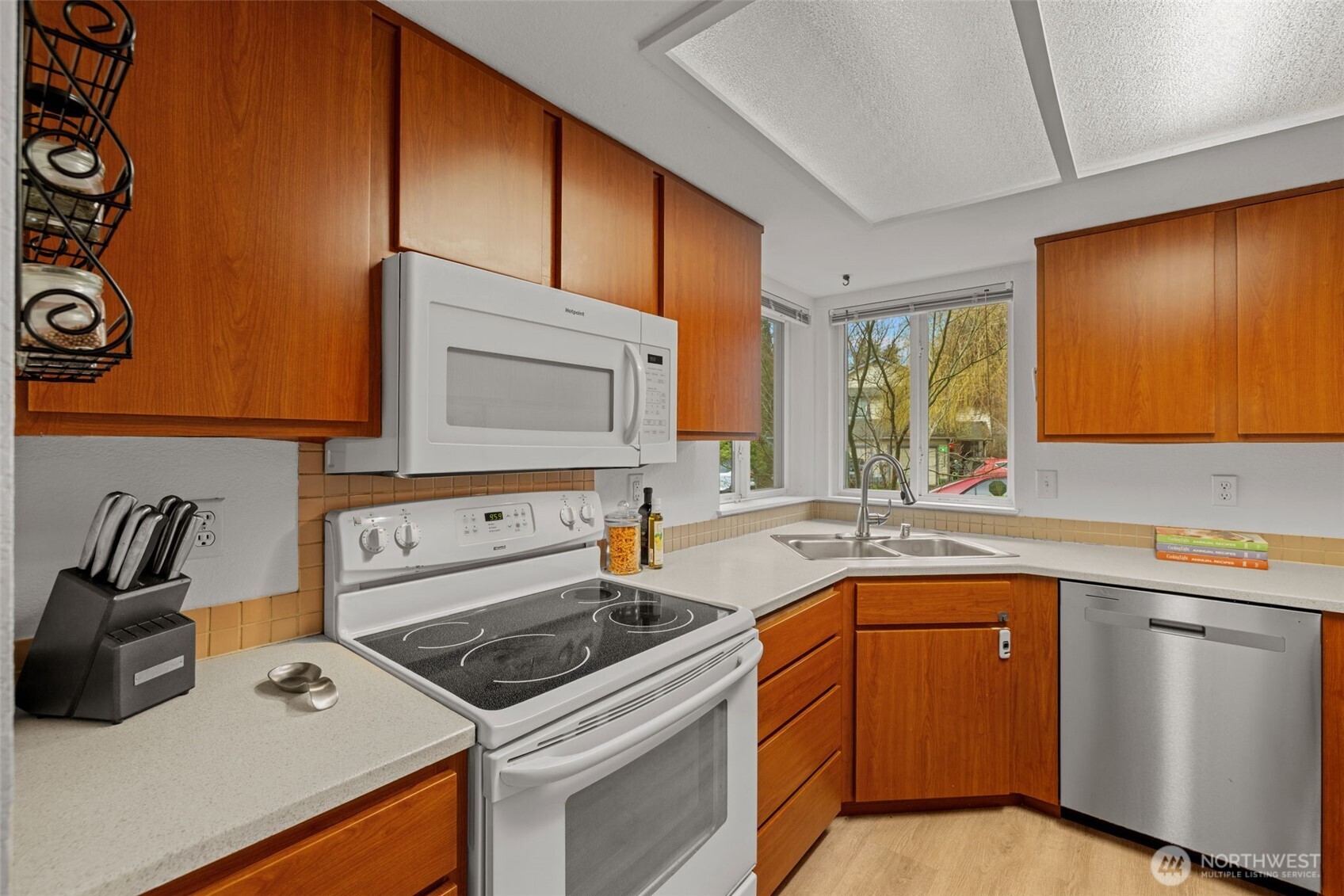 18429 20th Drive Southeast Bothell, WA 98012 - Photo 5 of 26 a kitchen with a sink stove and cabinets