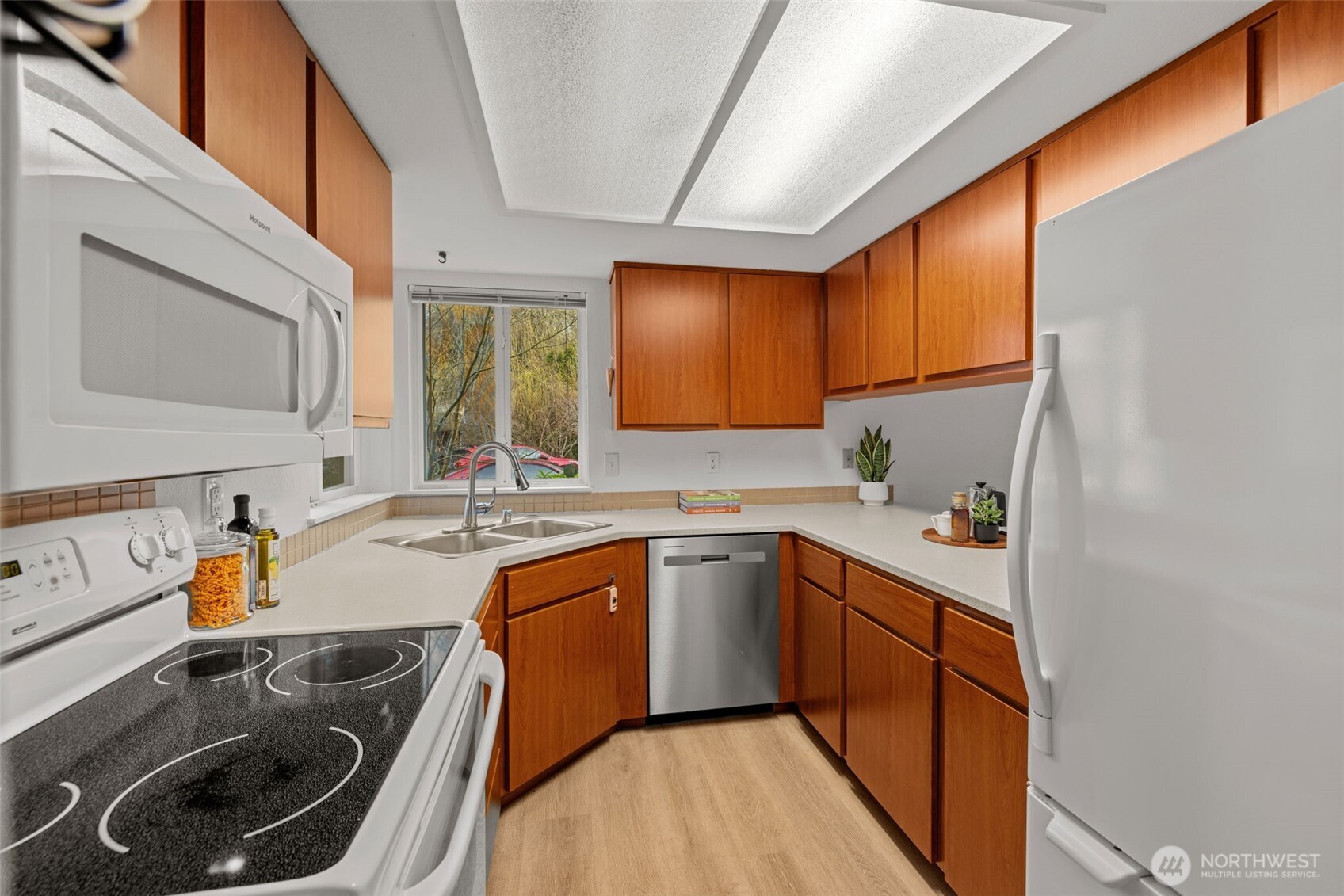 18429 20th Drive Southeast Bothell, WA 98012 - Photo 6 of 26 a kitchen with a sink a stove and cabinets