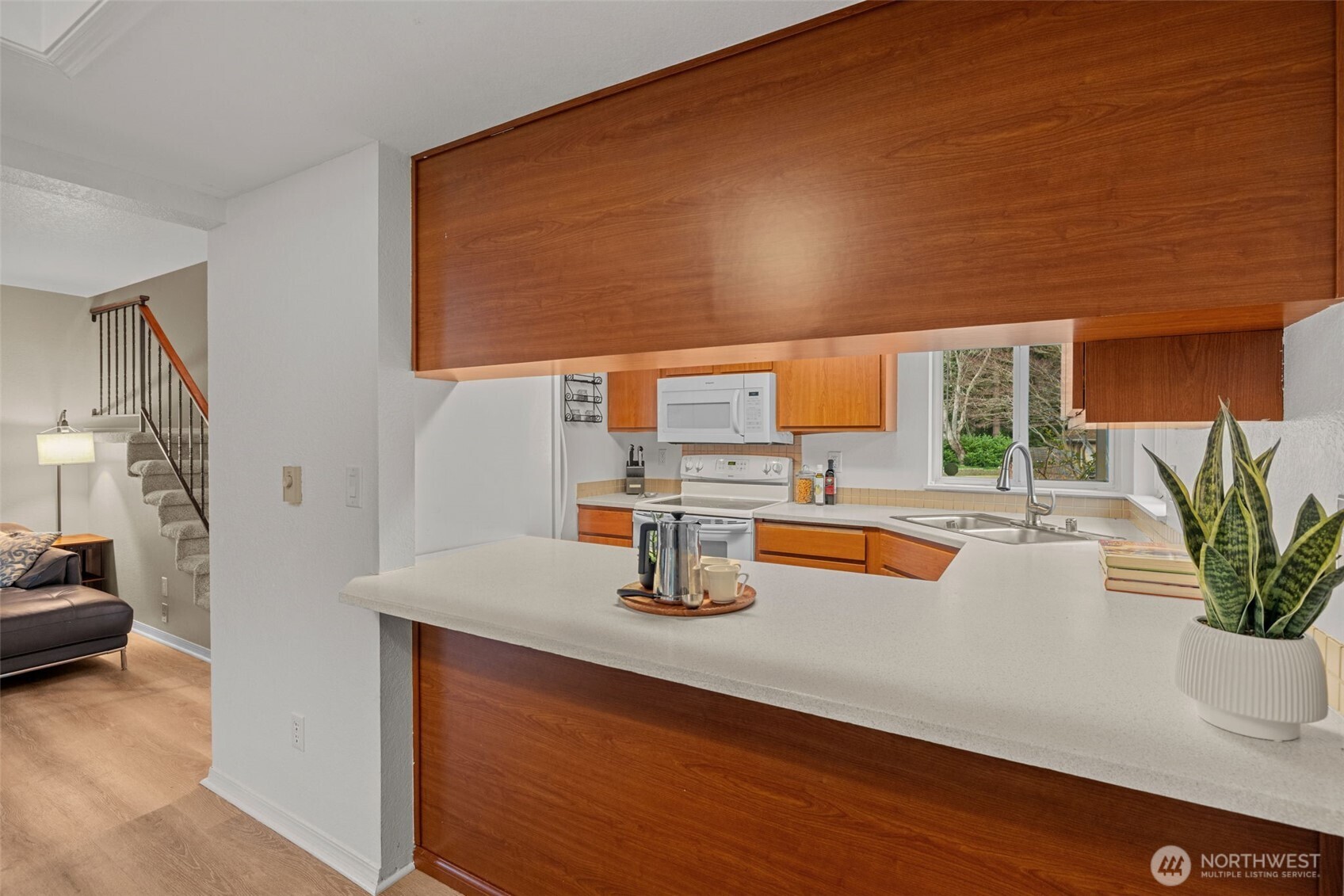 18429 20th Drive Southeast Bothell, WA 98012 - Photo 7 of 26 a kitchen with a sink and a potted plant