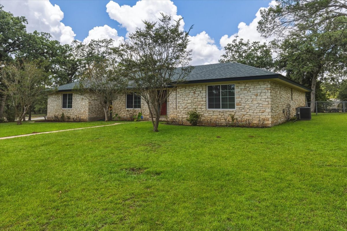 250 Hickory Drive Elgin, TX 78621 - Photo 3 of 37 a view of a house with a yard