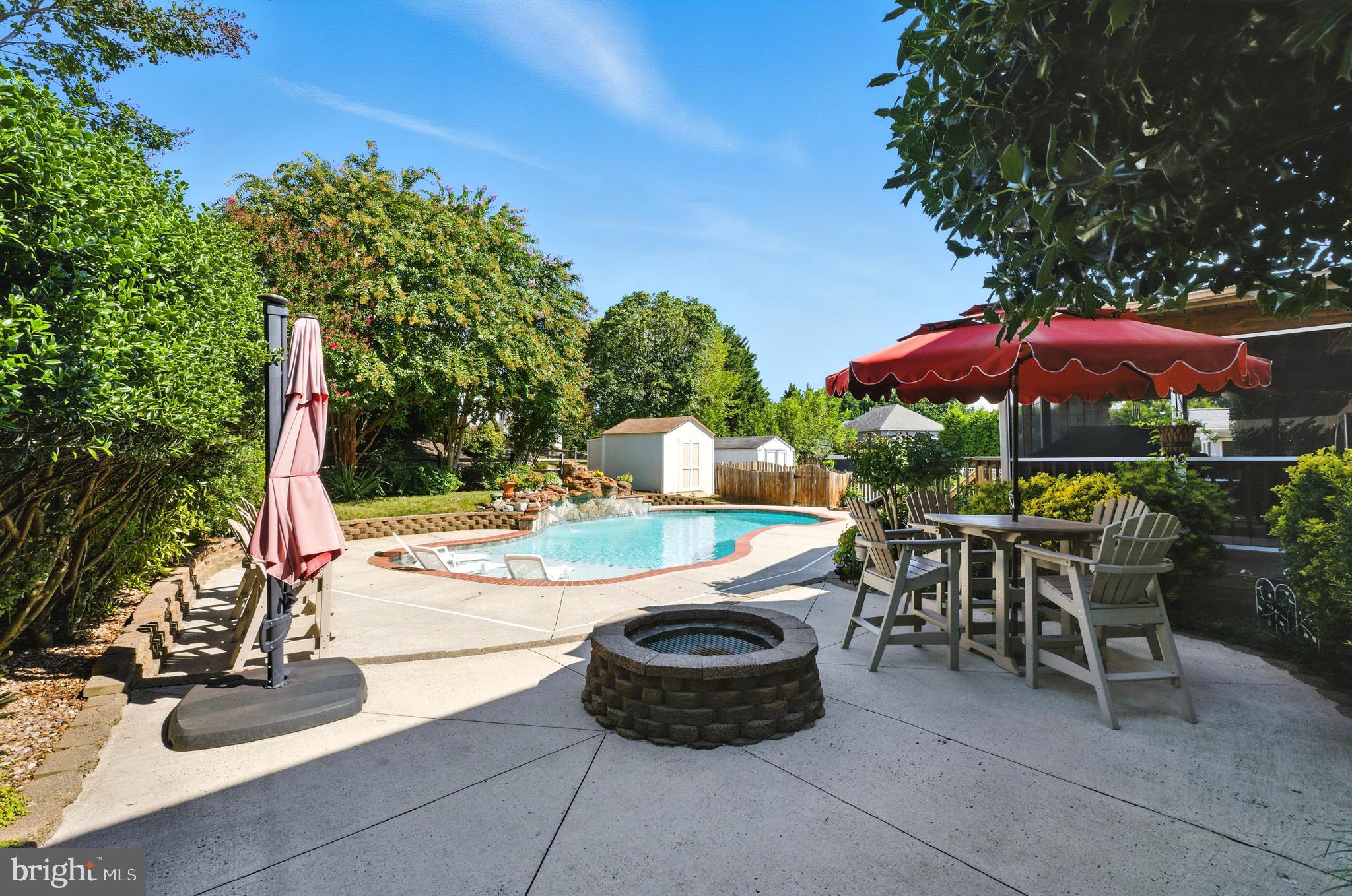 2605 Colpepper Road Abingdon, MD 21009 - Photo 26 of 95 a view of a patio with a table and chairs under an umbrella