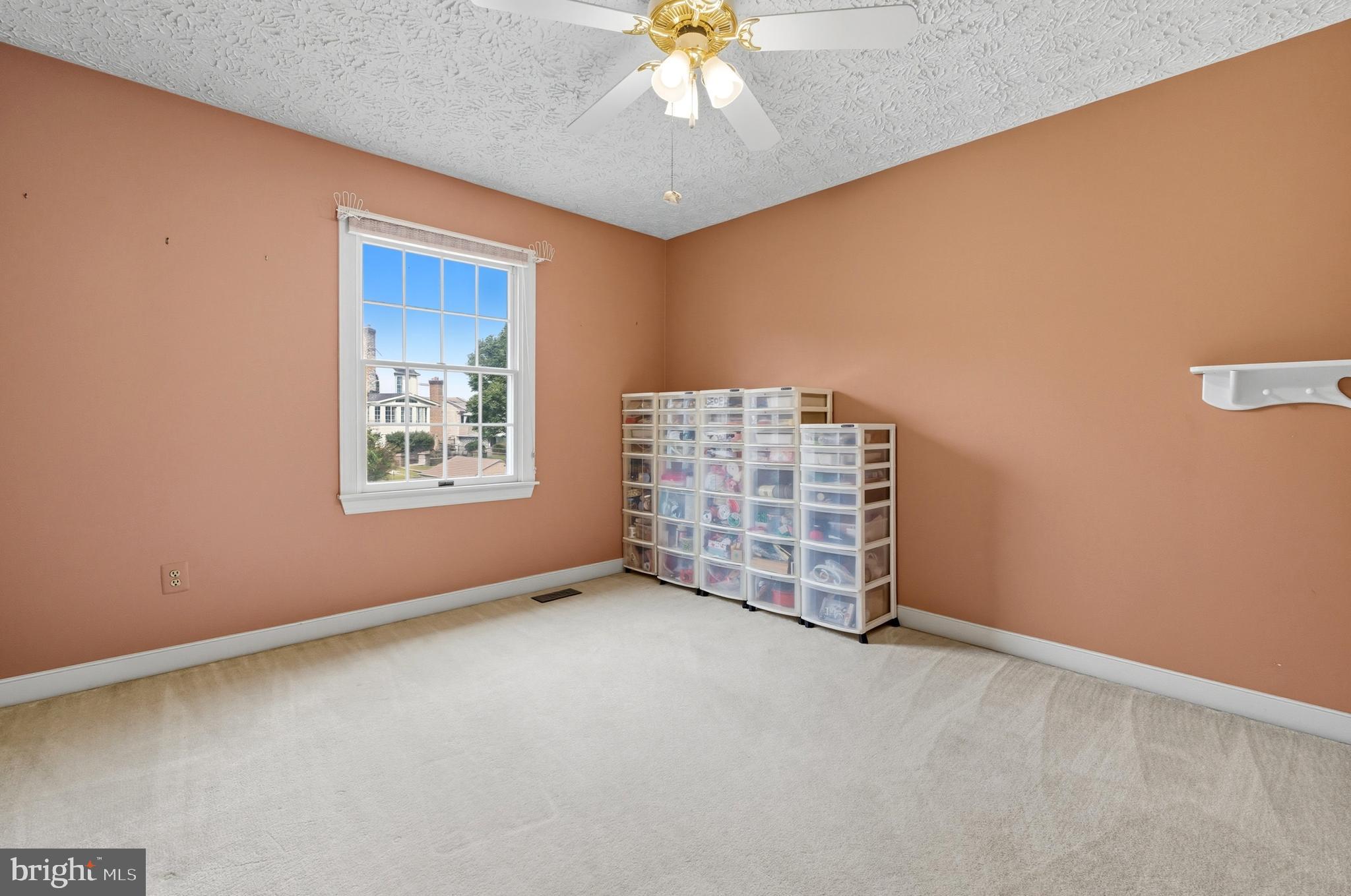 2605 Colpepper Road Abingdon, MD 21009 - Photo 57 of 95 an empty room with windows and chandelier fan