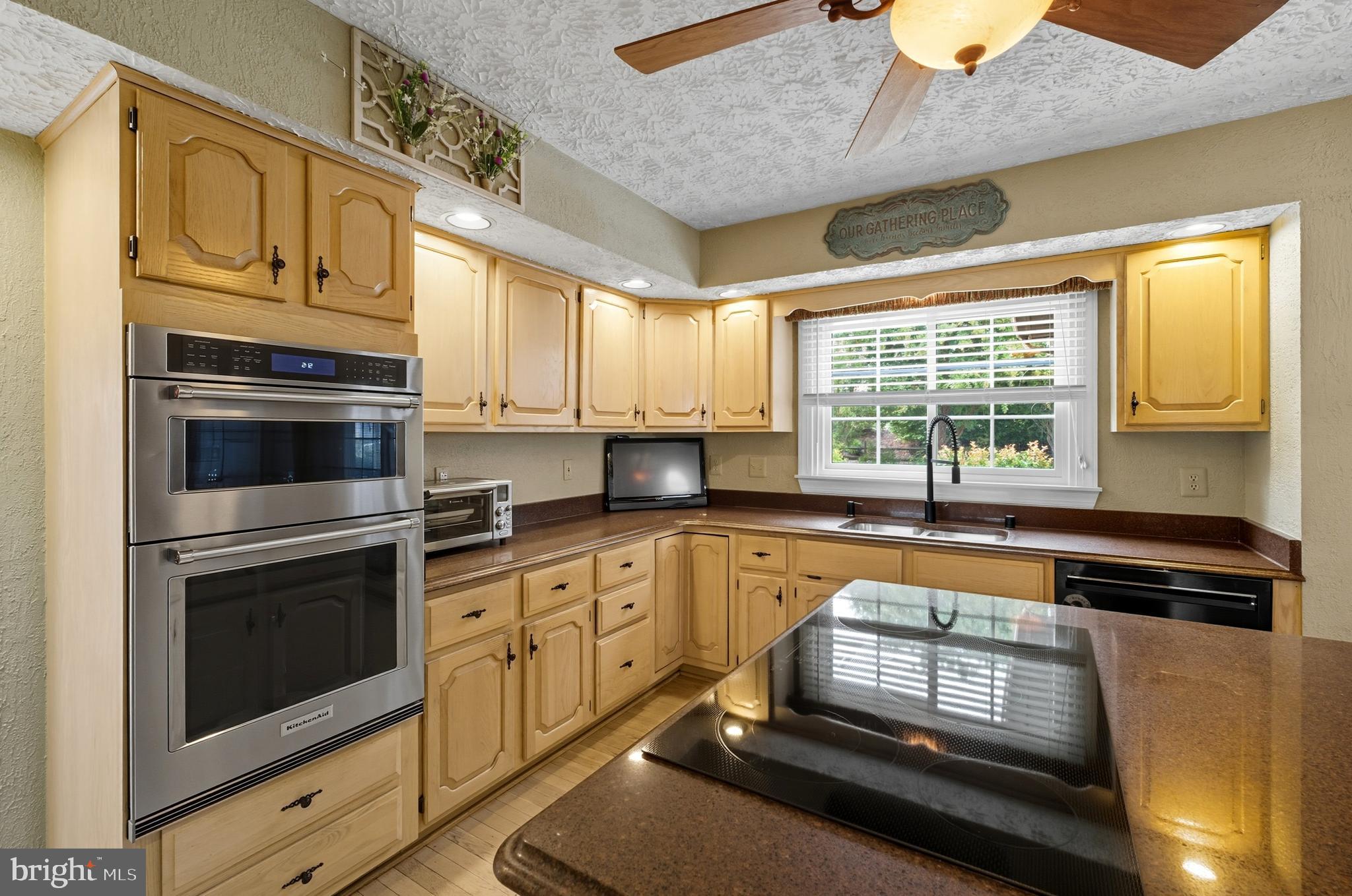 2605 Colpepper Road Abingdon, MD 21009 - Photo 9 of 95 a kitchen with granite countertop cabinets stainless steel appliances and a window