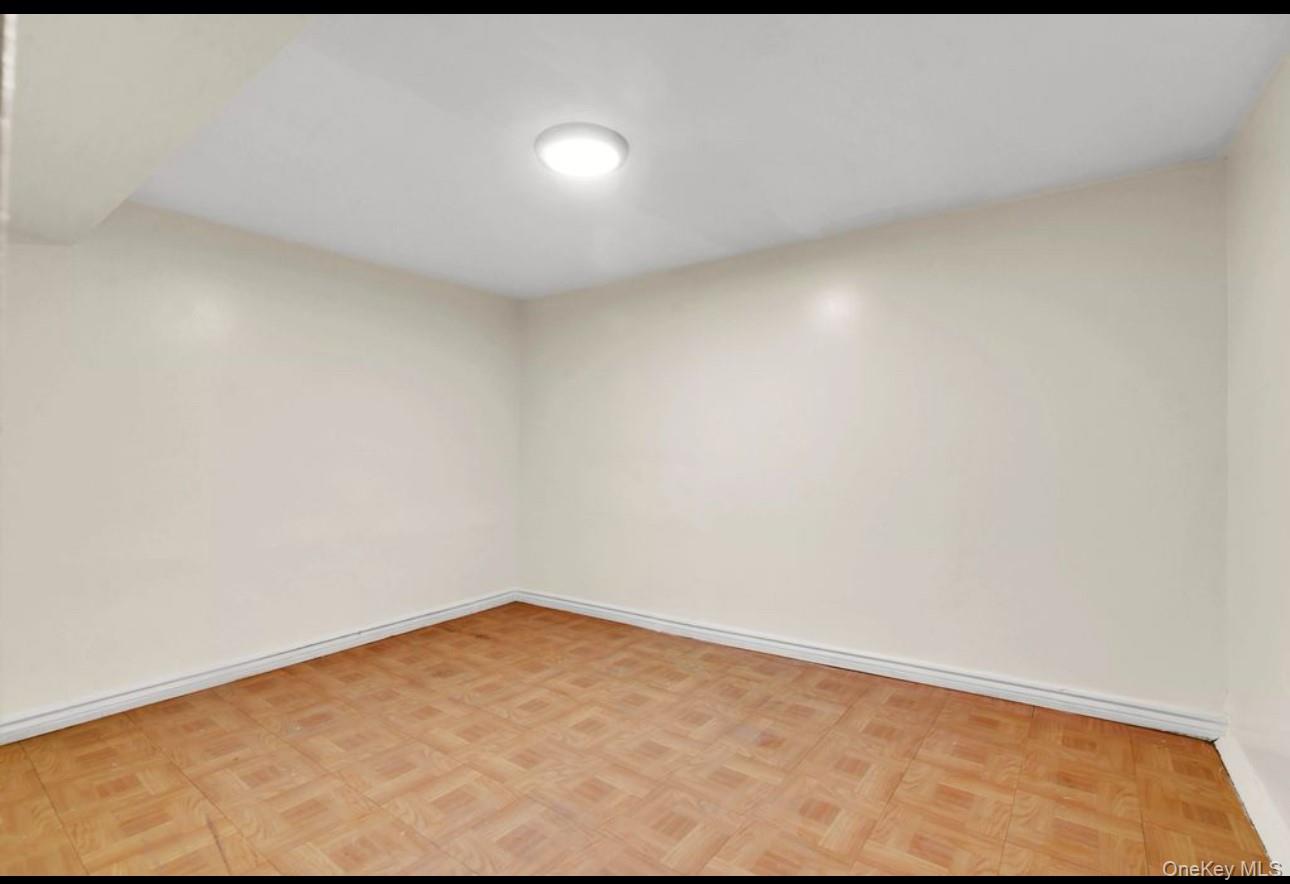 88-22 85th Street Queens, NY 11421 - Photo 28 of 33 Spare room with baseboards