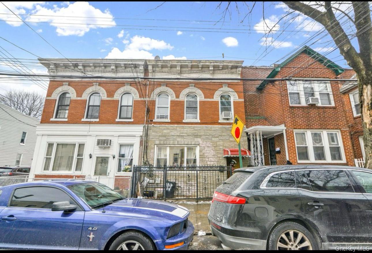 88-22 85th Street Queens, NY 11421 - Photo 3 of 33 View of front facade with brick siding