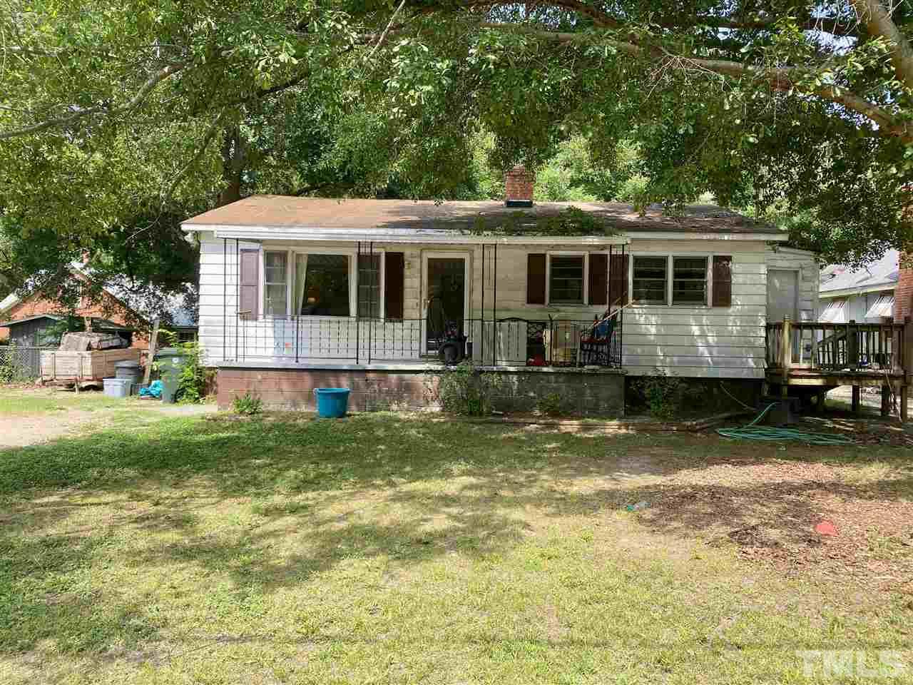 1005 Fuller Street Raleigh, NC 27603 - Photo 1 of 13 a view of a house with a yard