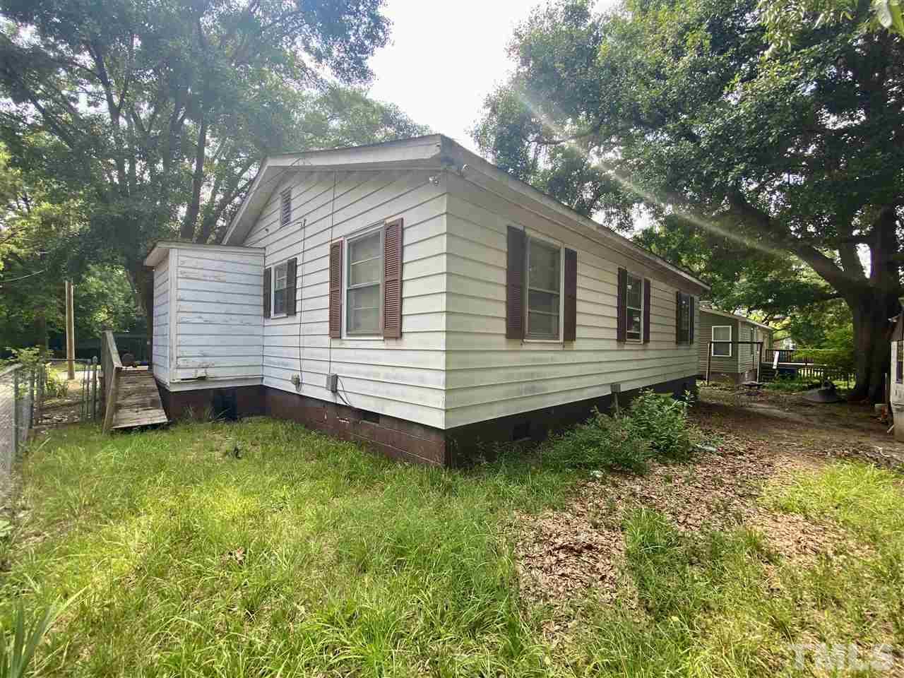1005 Fuller Street Raleigh, NC 27603 - Photo 10 of 13 a view of a backyard with a small cabin