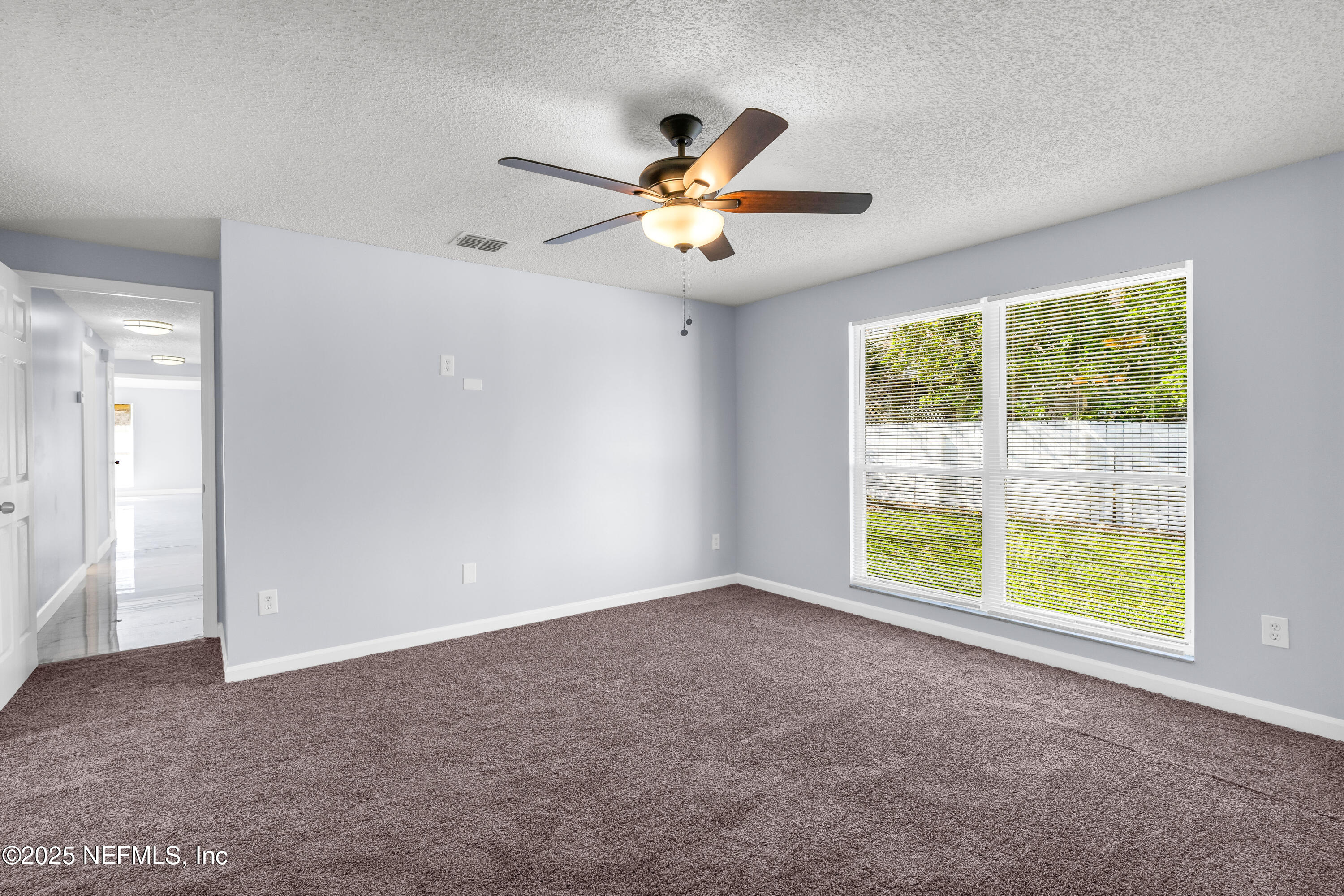 3950 Star Tree Road Jacksonville, FL 32210 - Photo 13 of 33 a view of an empty room with a window
