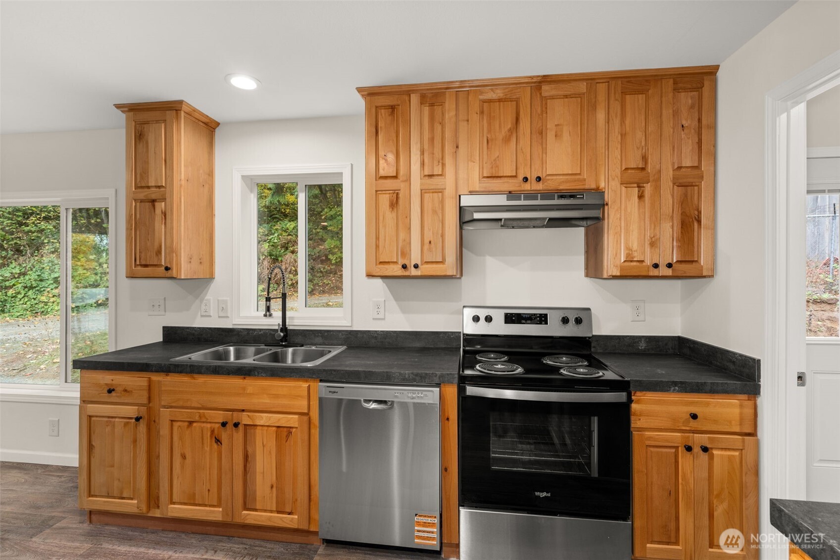 172 Boyd Road Randle, WA 98377 - Photo 13 of 30 a kitchen with stainless steel appliances granite countertop a stove and a sink