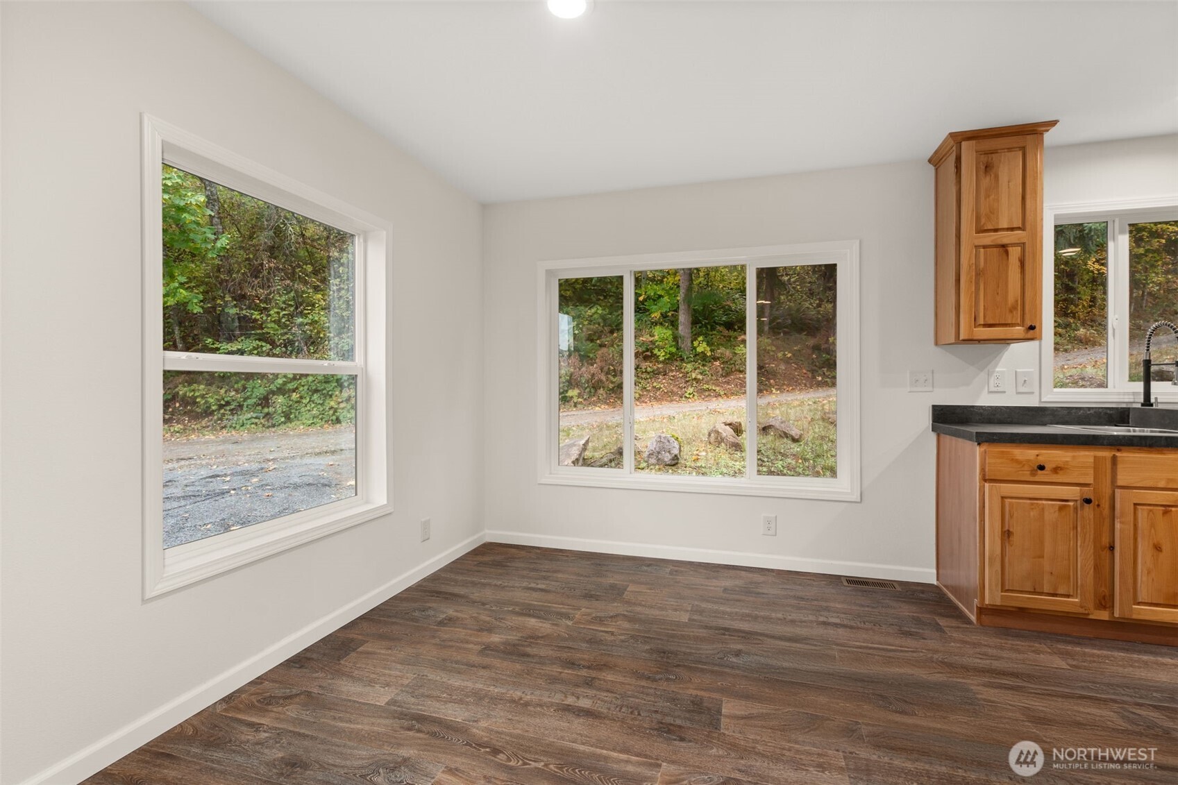 172 Boyd Road Randle, WA 98377 - Photo 15 of 30 an empty room with wooden floor and windows