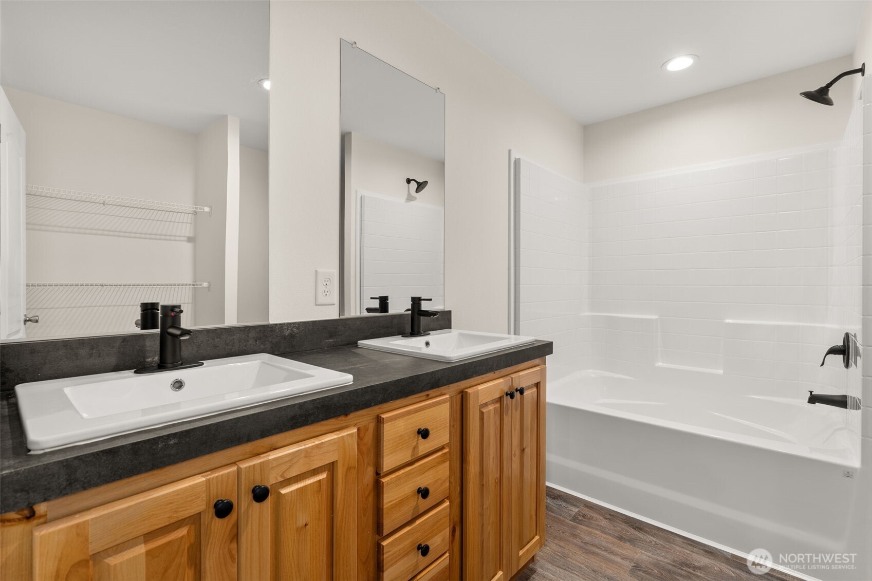 172 Boyd Road Randle, WA 98377 - Photo 18 of 30 a bathroom with a double vanity sink and a bathtub