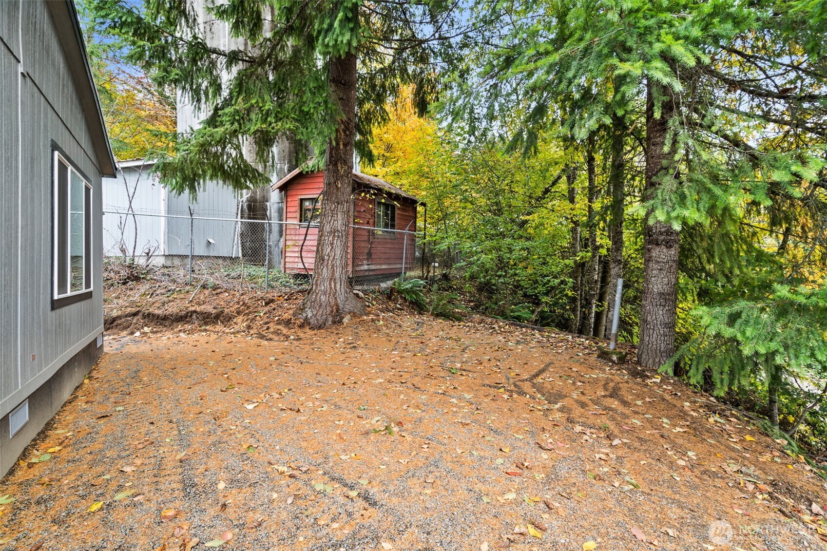 172 Boyd Road Randle, WA 98377 - Photo 26 of 30 a yellow house with trees in front of it