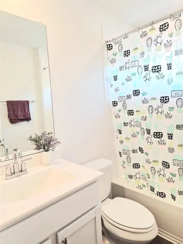 a bedroom with a bed and a rug