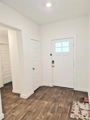 a room with gym equipment and windows