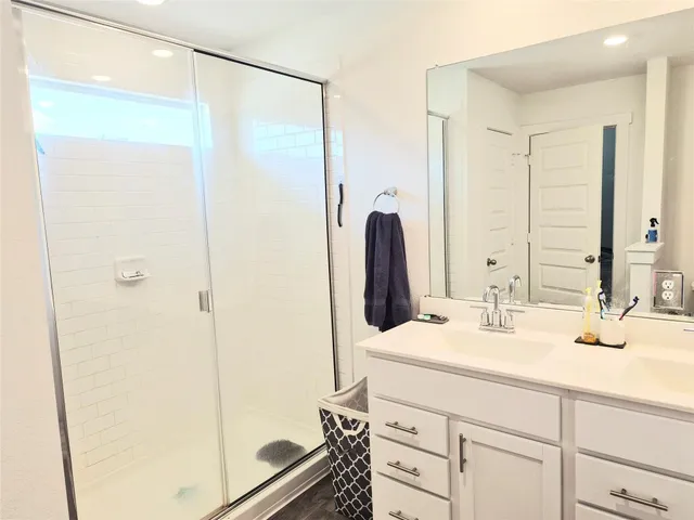 a bedroom with a bed and a cabinets