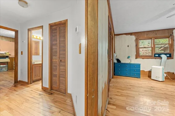a bedroom with a bed and closet