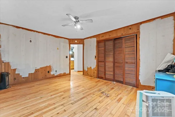 a kitchen with stainless steel appliances a stove top oven a sink a counter space and cabinets