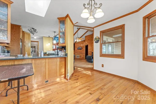a view of a living room and kitchen