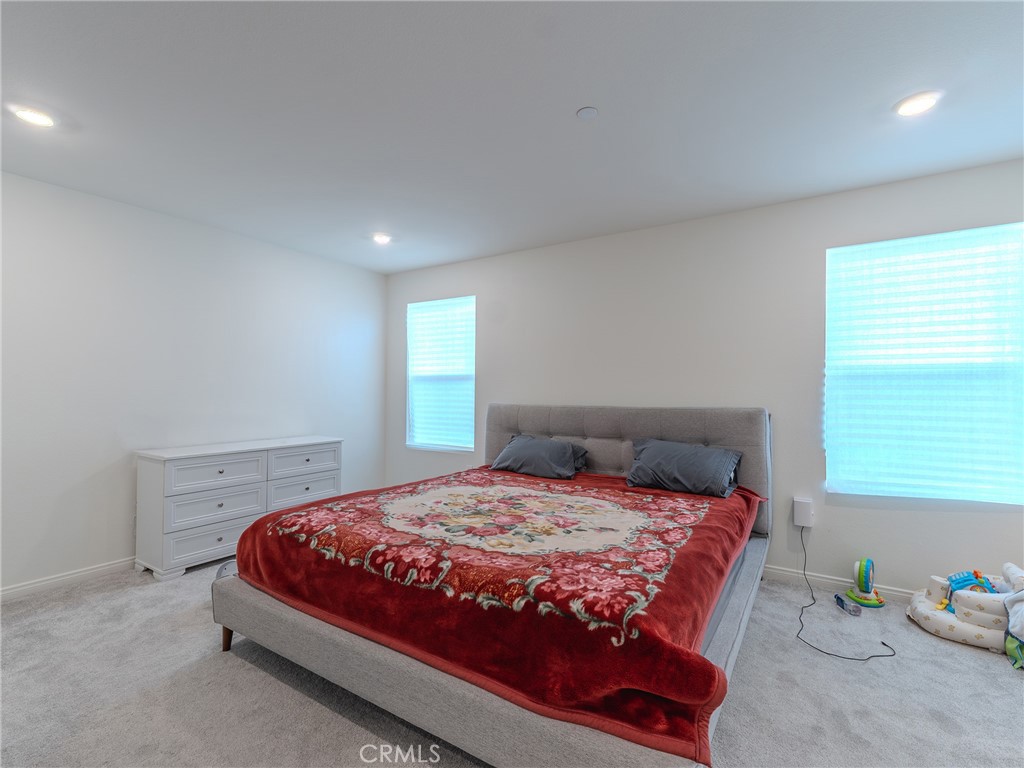 25602 Pne Rdg Road Homeland, CA 92548 - Photo 19 of 35 a bedroom with a bed and a window