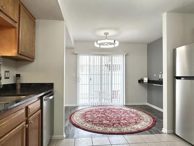 a view of a kitchen with a sink and cabinets