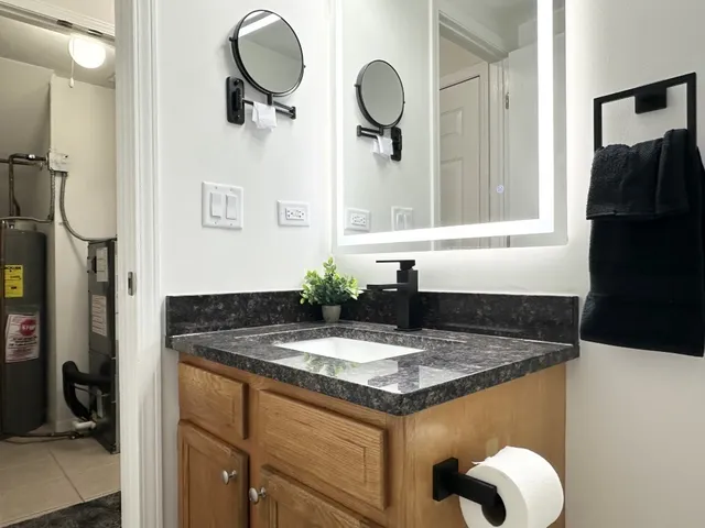 a sink vanity and a mirror