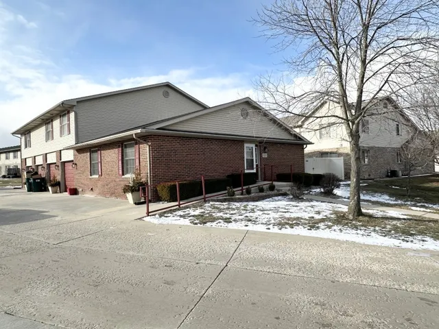 a wooden house with trees in front of it